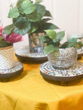 Handcrafted 4-tier mosaic plant stand set with colorful ceramic tiles, designed for indoor or outdoor display.