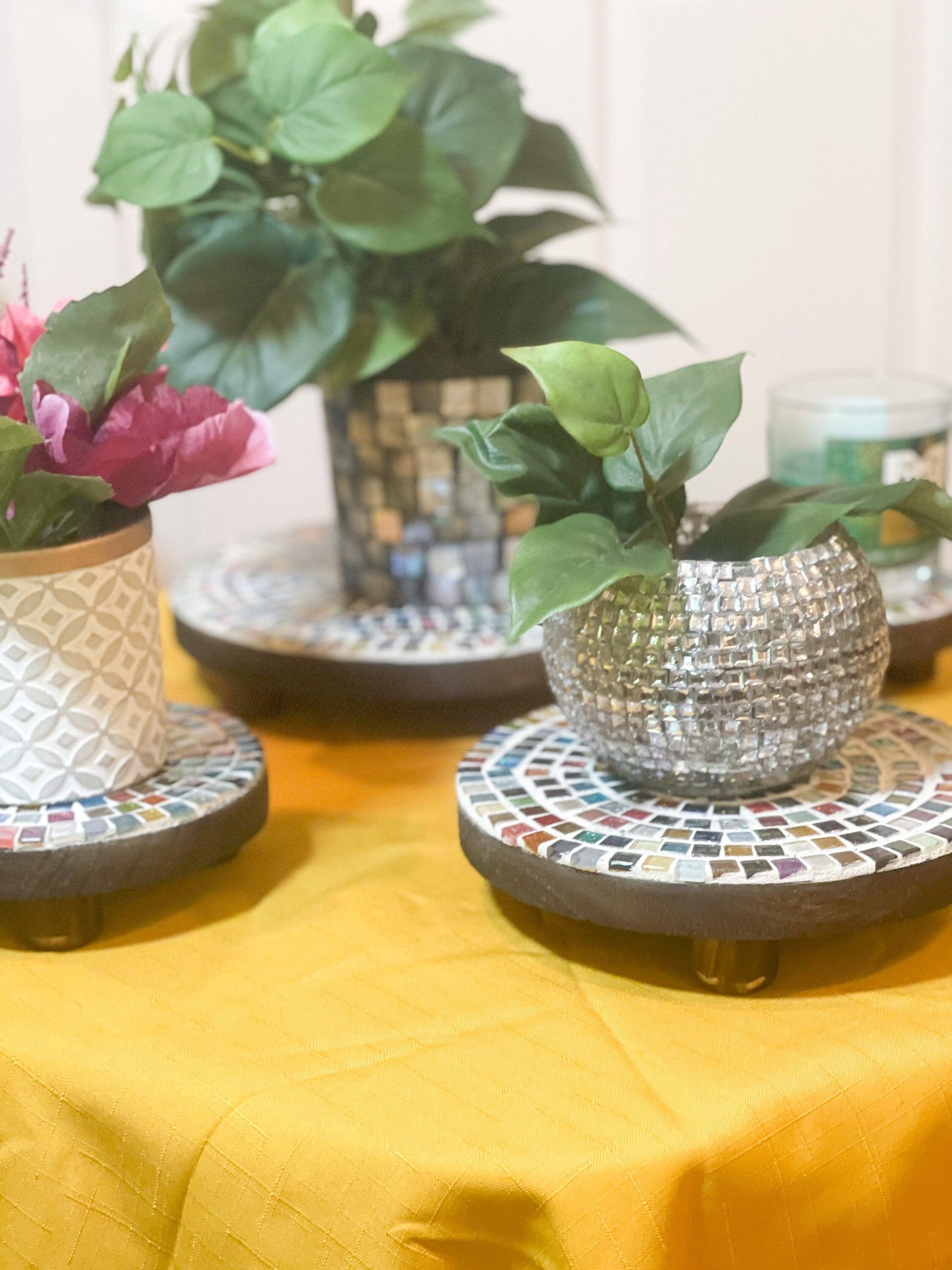 Handcrafted 4-tier mosaic plant stand set with colorful ceramic tiles, designed for indoor or outdoor display.