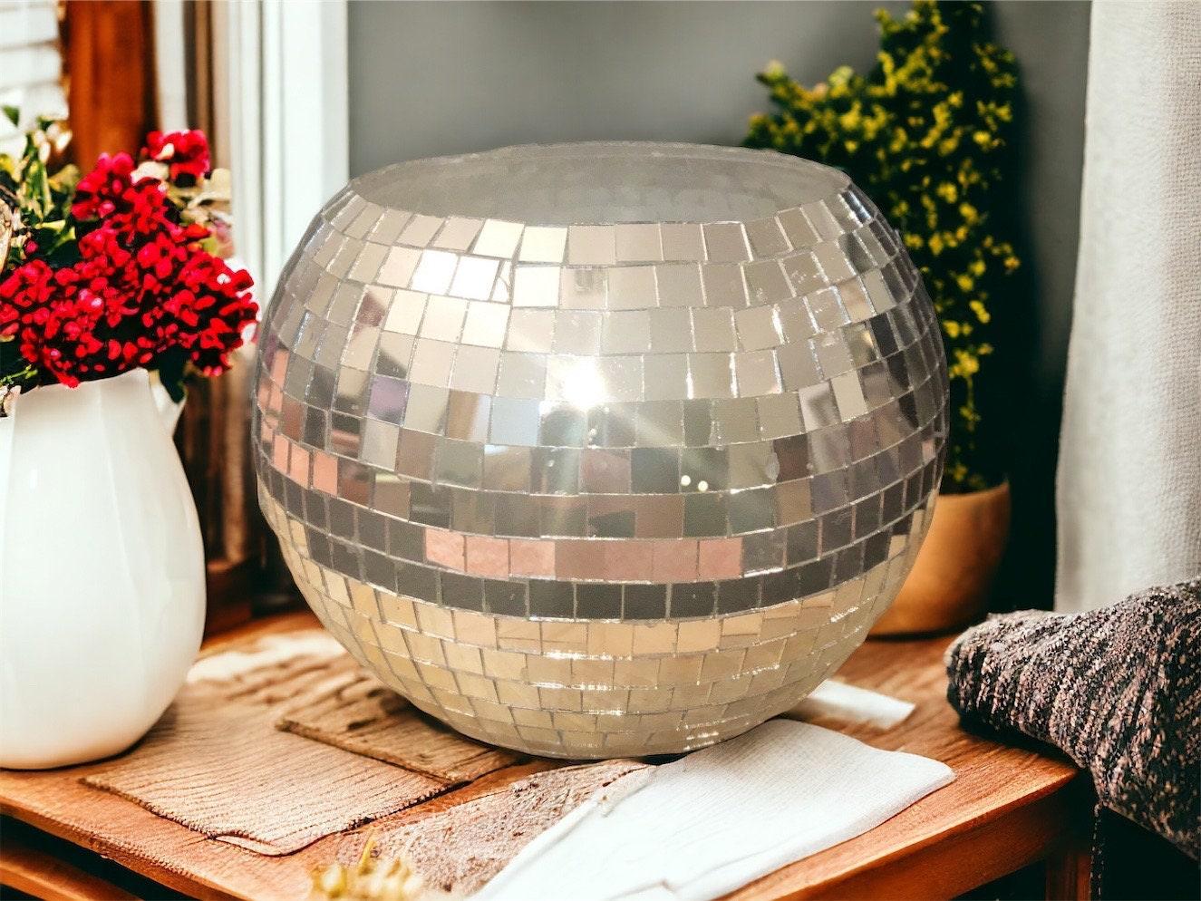 Mirror ball disco globe vase with reflective surface and spherical shape, perfect for decorative display.