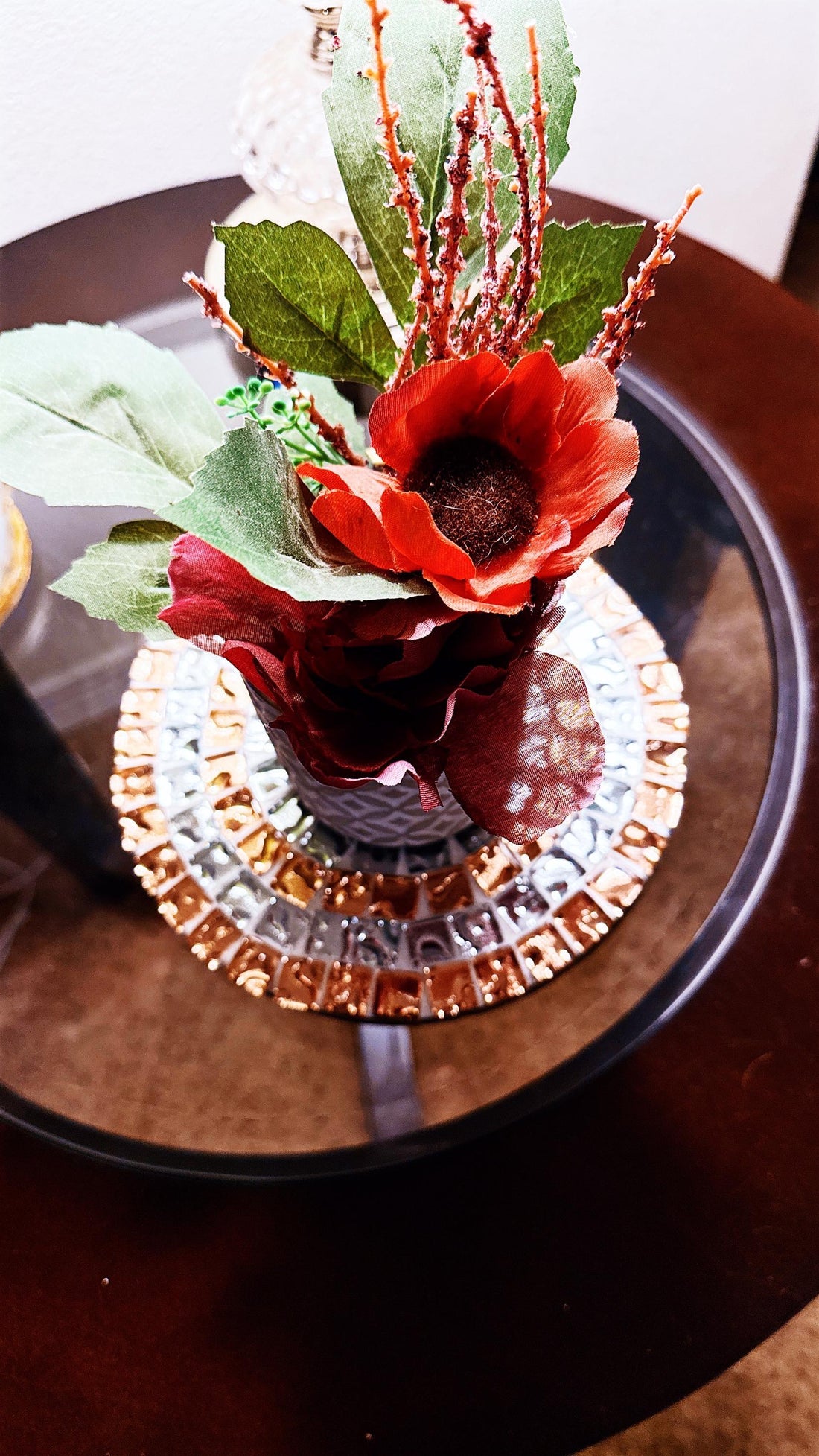 Handcrafted metallic mosaic plant stand set featuring intricate patterns and multiple tiers for displaying potted plants.