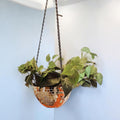 Hanging disco ball planter with artificial pink carnations, decorative home accessory by Miss Bette's Creations.