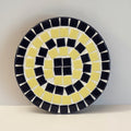 Handmade cobalt blue and yellow mosaic plant stand with intricate tile design, perfect for indoor or outdoor decor.