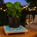 Handcrafted square turquoise mother of pearl plant stand with elegant design and glossy finish, perfect for displaying indoor plants.