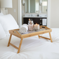 Rustic bamboo bed tray with stone mosaic inlay, featuring handles for serving breakfast or snacks in a natural, handcrafted design.