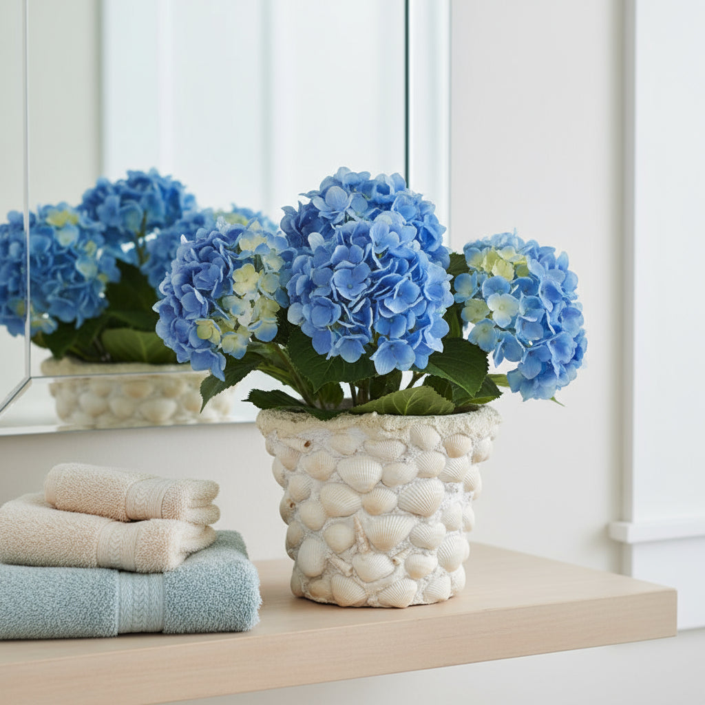 Handcrafted seashell mosaic plant pot with colorful shell patterns, perfect for indoor or outdoor decorative gardening.