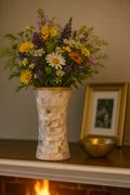 Elegant mother of pearl mosaic flower vase with intricate floral design, featuring shimmering pearl accents and a glossy finish.