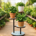 Three-tier mosaic multi-level plant stand with colorful tiled shelves, ideal for displaying indoor or outdoor plants.