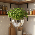 Hanging disco ball planter by Miss Bette's Creations with artificial pink carnations and reflective surface.