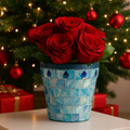 Turquoise mother of pearl flower pot with floral design, showcasing a decorative ceramic planter with iridescent finish.