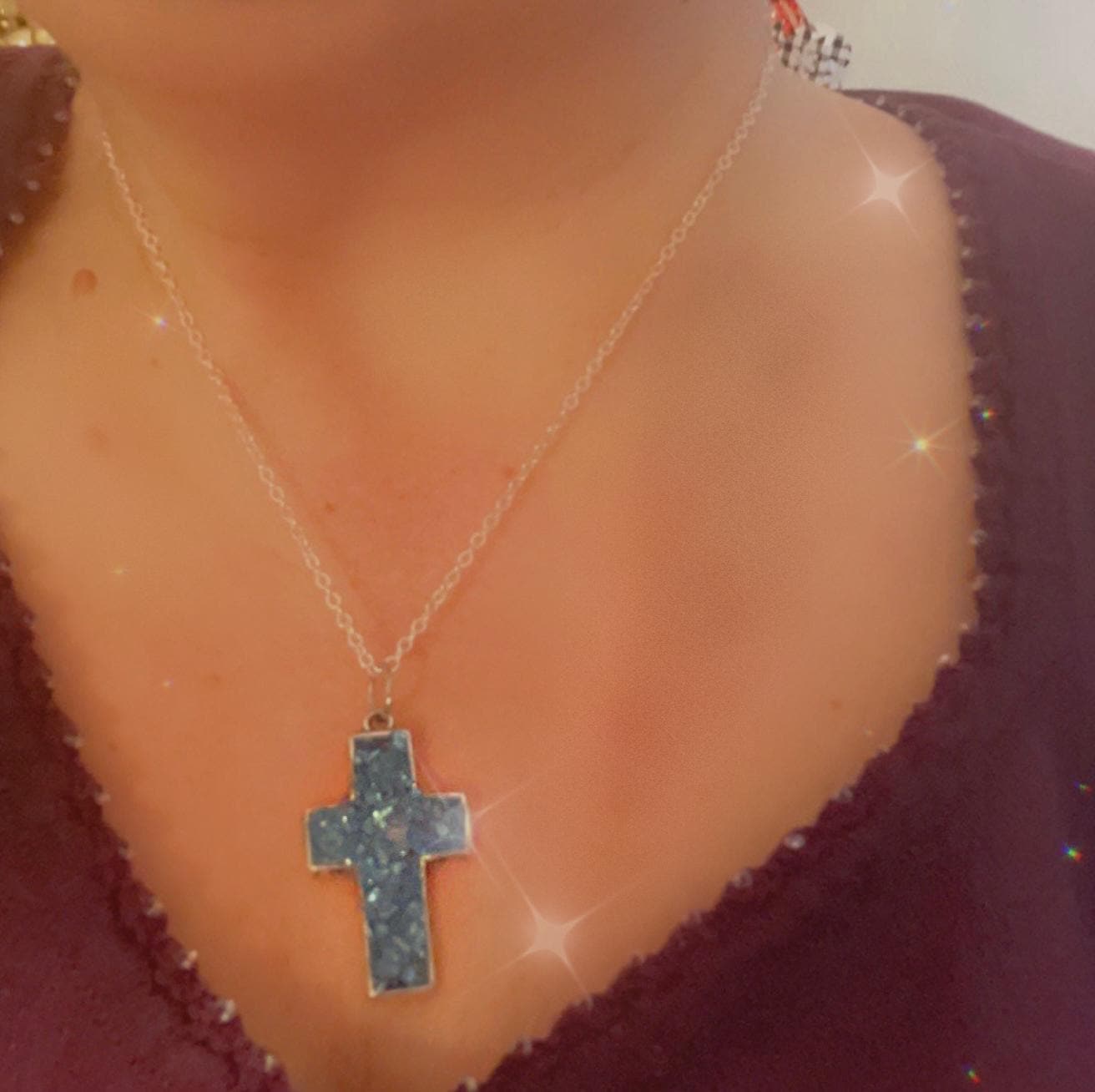 Turquoise glass cross set in silver featuring multiple cross pendants, displayed on a neutral background.