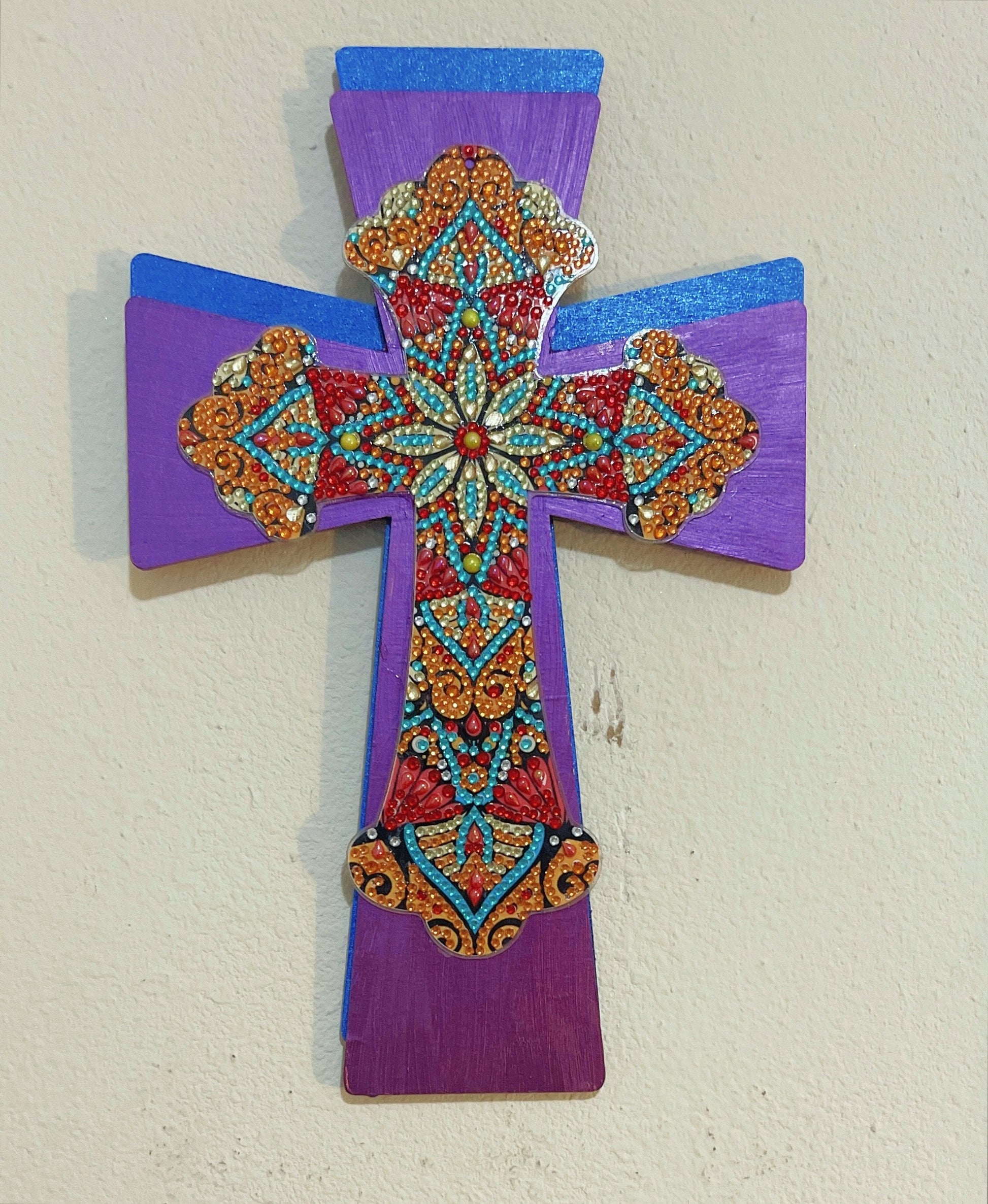 Handmade decorated Christian cross wall hanging with intricate design, perfect for religious home decor.