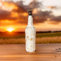 Handcrafted glass carafe with shell design and decorative bottle stopper, featuring elegant clear glass and intricate detailing.
