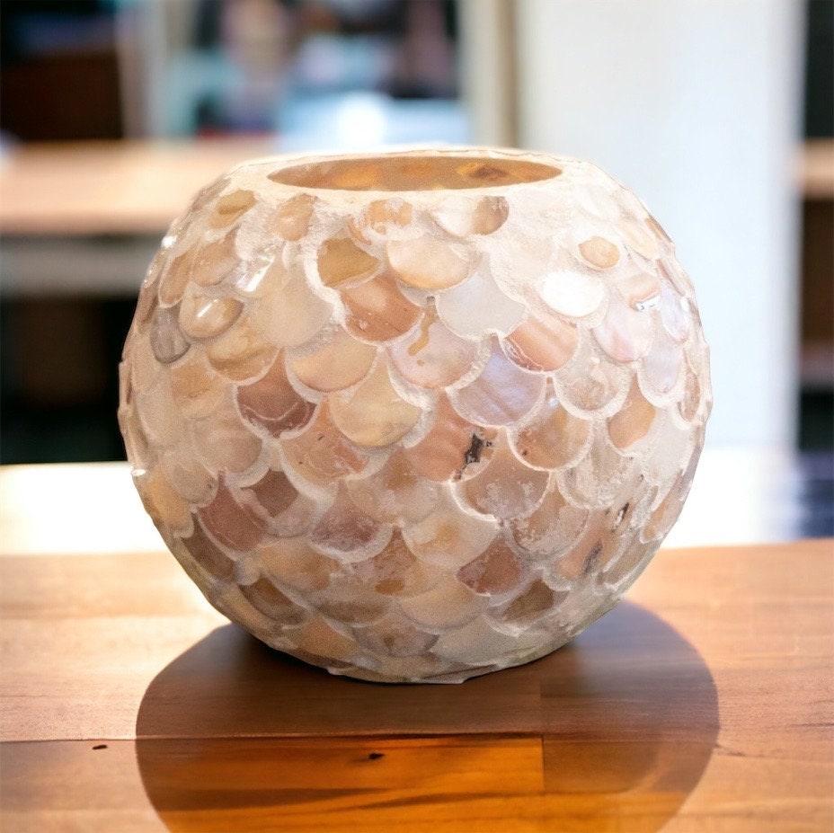 Handcrafted scalloped Capiz shell globe vase with a delicate, shimmering design for elegant home décor.