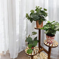 Handcrafted 3-tier mosaic plant stand with colorful tile design, ideal for displaying potted plants indoors or outdoors.