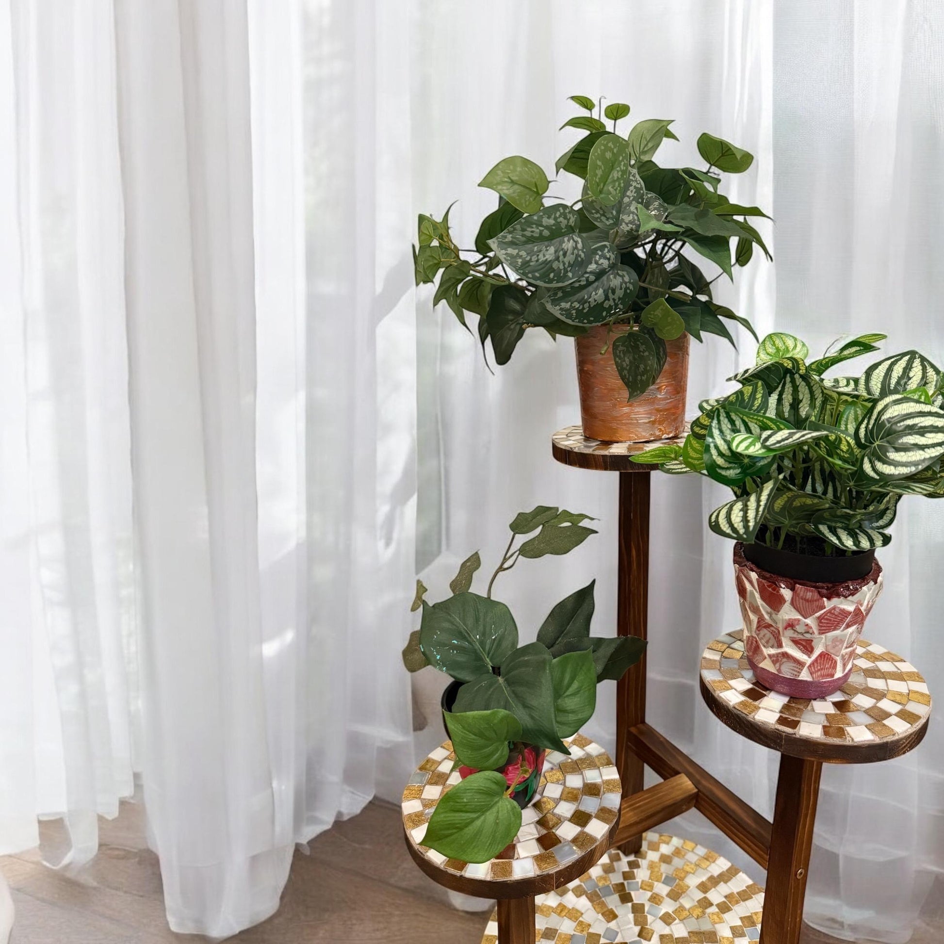 Handcrafted 3-tier mosaic plant stand with colorful tile design, ideal for displaying potted plants indoors or outdoors.