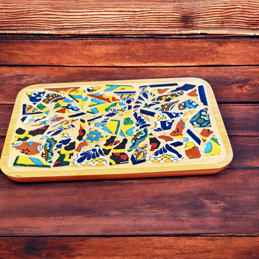 Handmade Mexican Talavera mosaic bamboo tray with colorful geometric patterns and natural bamboo handles.