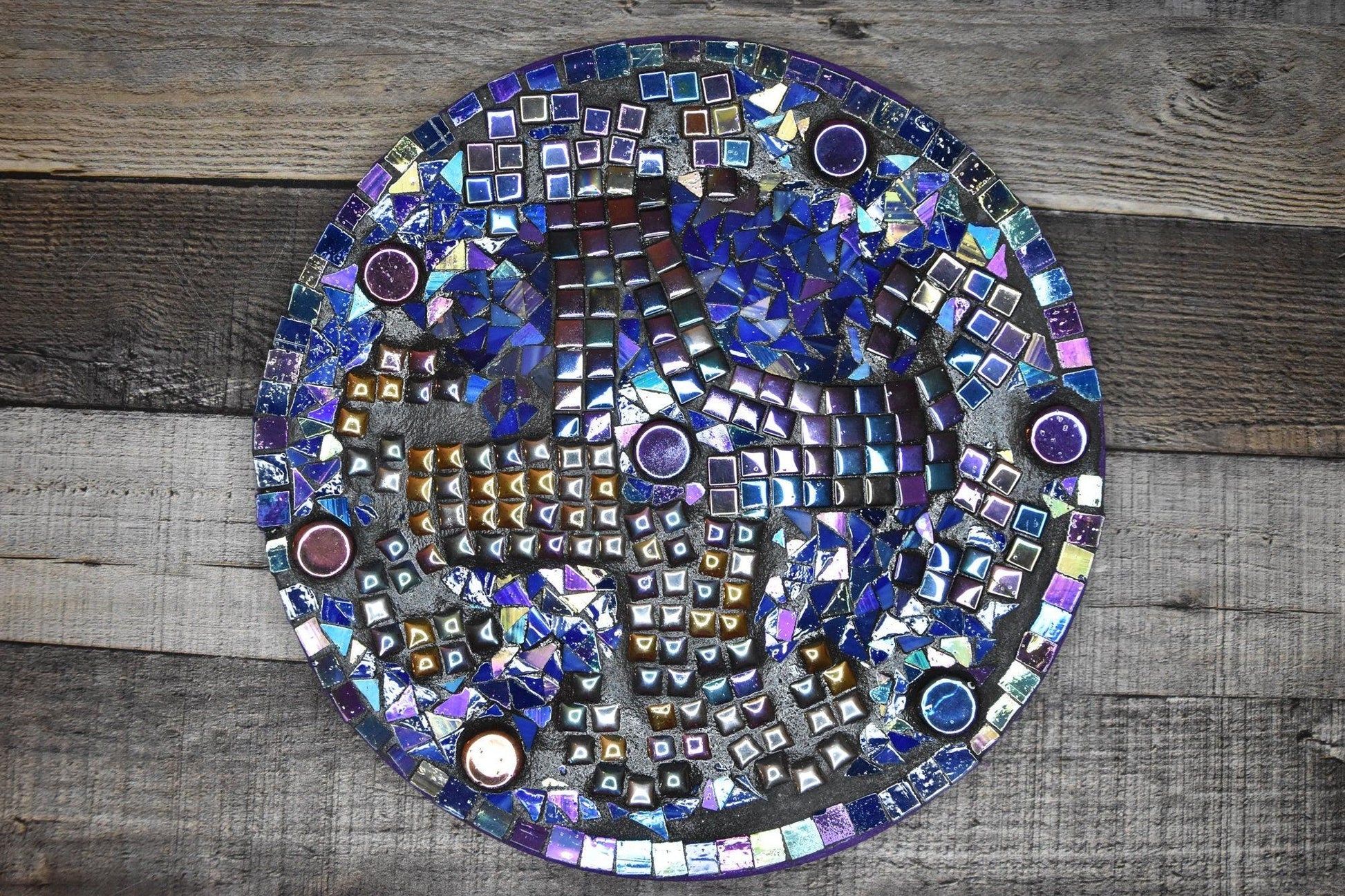 Colorful iridescent mosaic wall art featuring handcrafted glass tiles, perfect for decorative home wall accents.