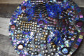 Handcrafted iridescent mosaic wall art featuring colorful glass tiles, perfect for vibrant home decor.
