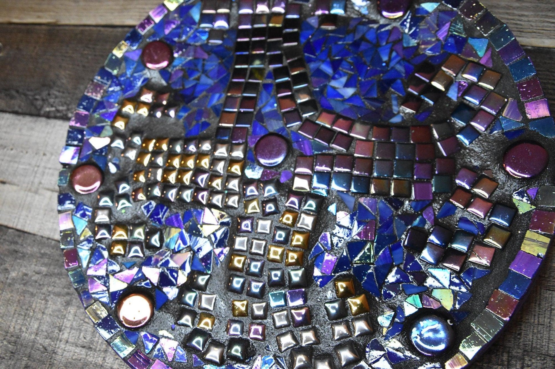 Handcrafted iridescent mosaic wall art featuring colorful glass tiles, perfect for vibrant home decor.