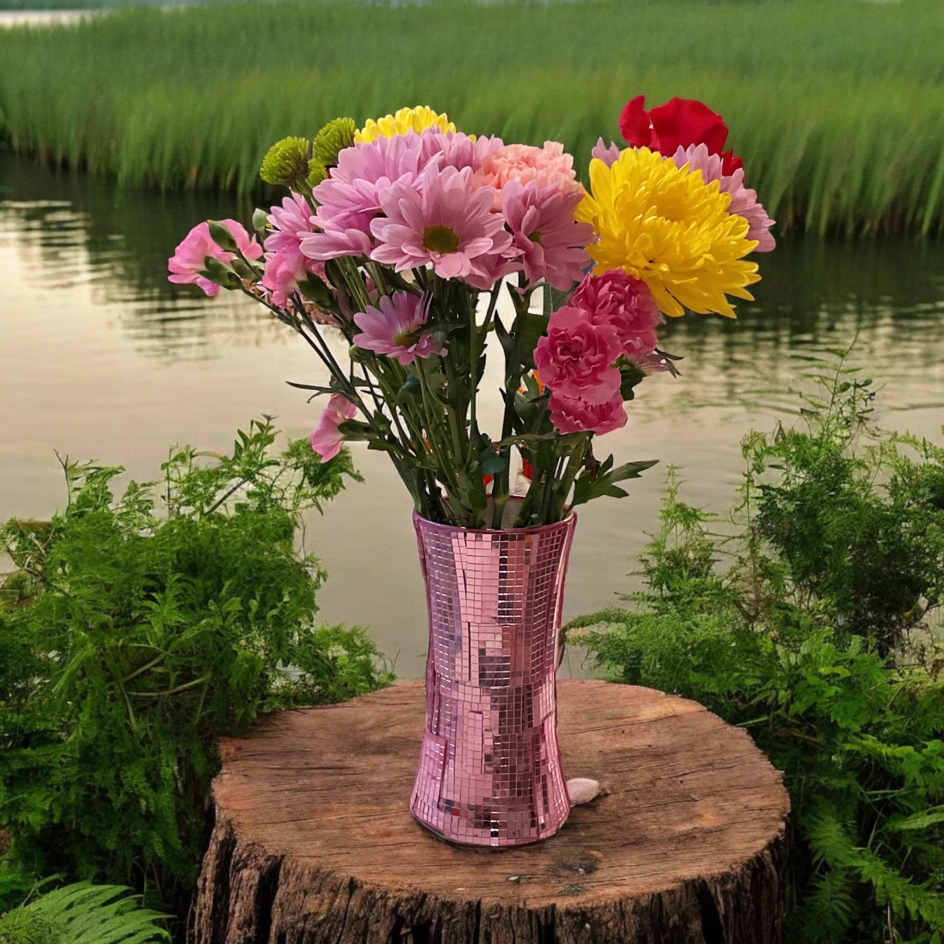 Handcrafted pink disco ball mirror vase with reflective surfaces, designed for decorative display and floral arrangements.