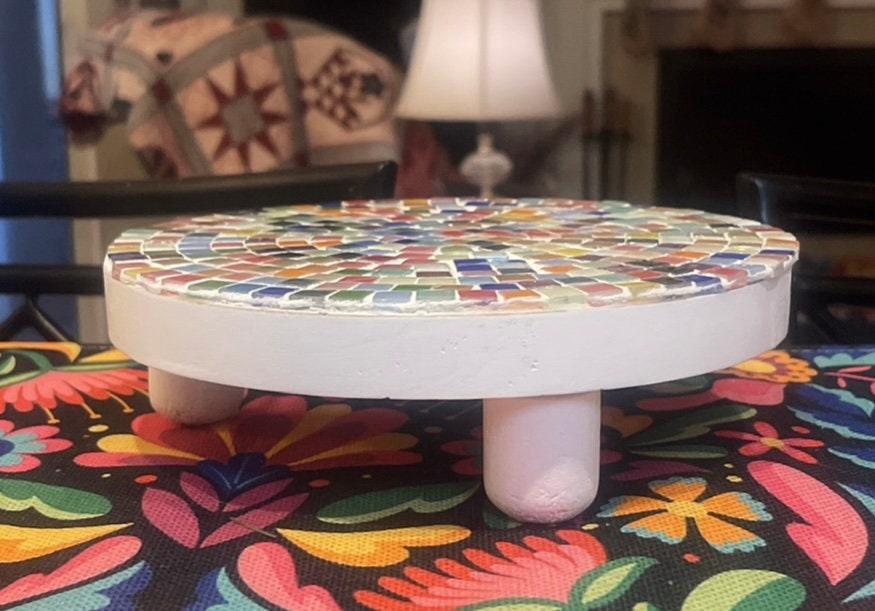 White rainbow mosaic plant stand with handcrafted design, featuring colorful mosaic tiles and sturdy white base.