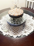 Set of handcrafted metallic mosaic plant stands with intricate patterns, perfect for displaying potted plants indoors or outdoors.