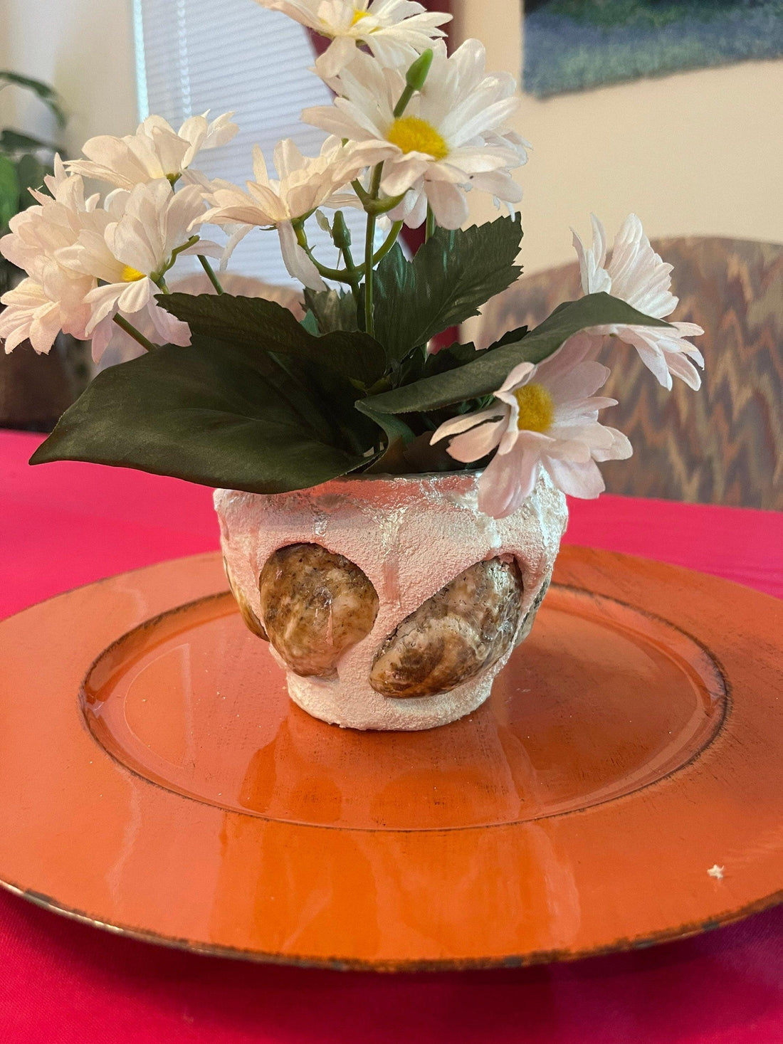 Handcrafted seashell and sandstone mini planter with natural textures, perfect for small indoor plants or decorative displays