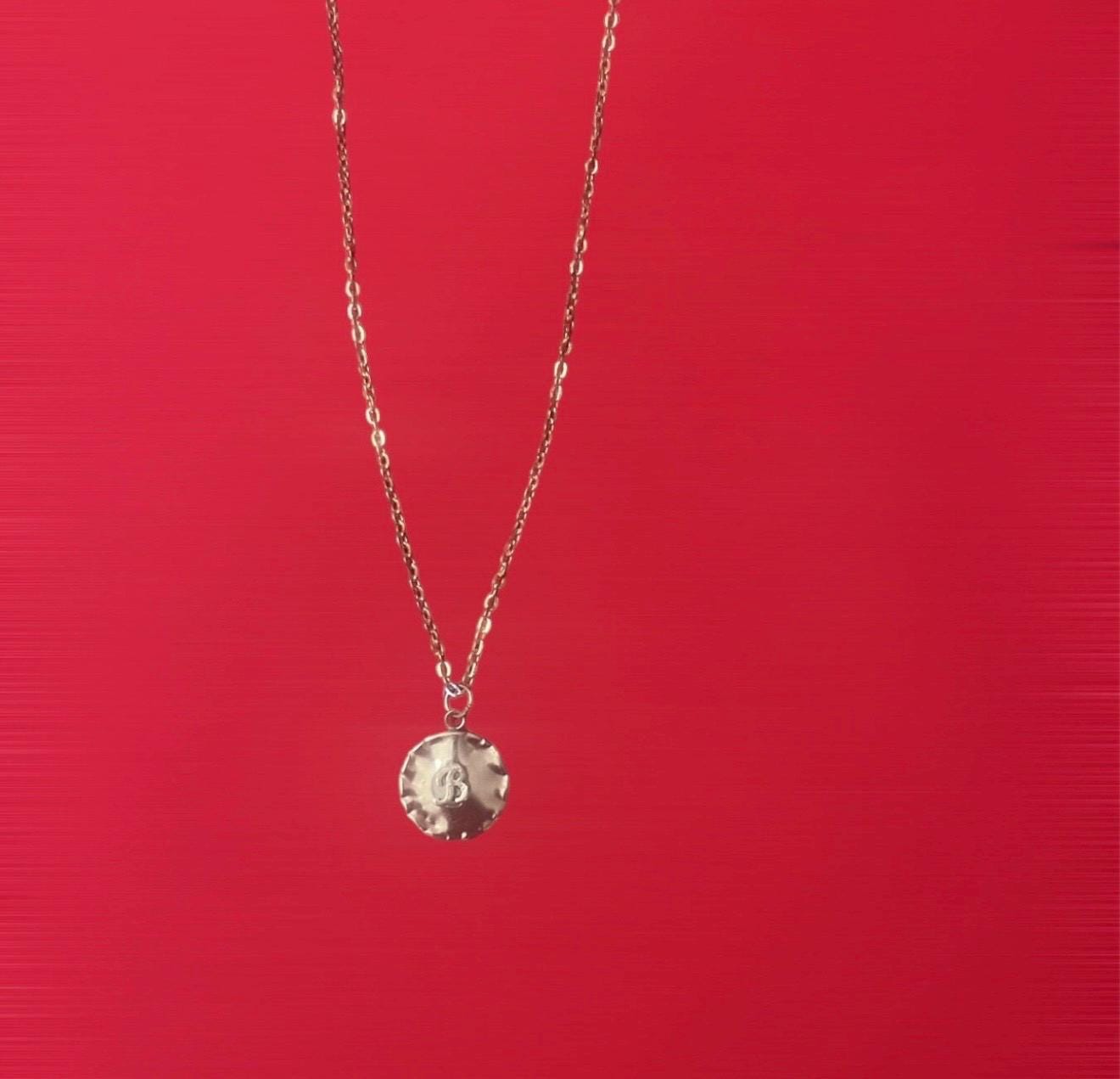 Vintage initial charm necklace with a silver chain and personalized initial pendant, featuring a classic and elegant design.