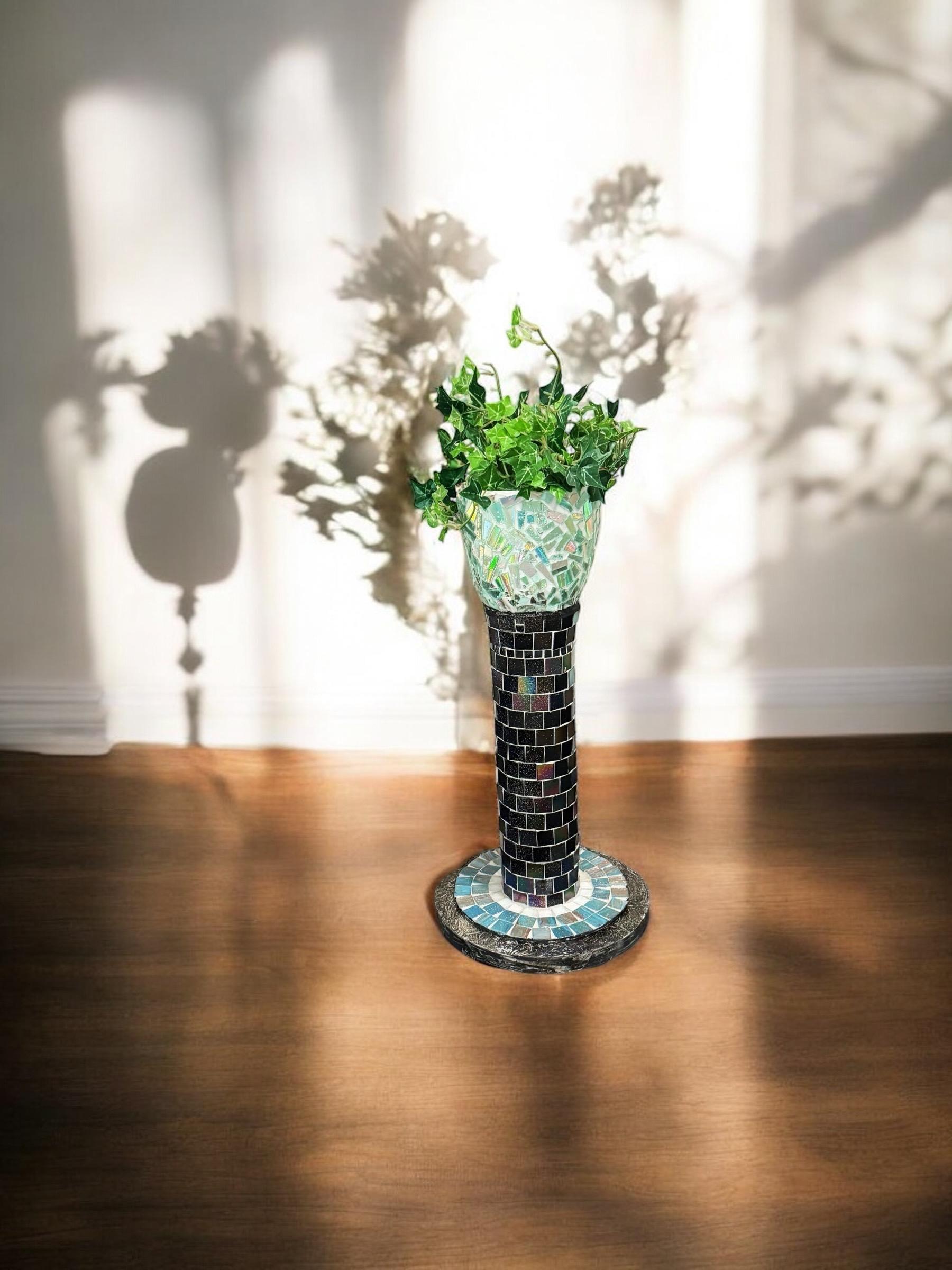 Colorful handcrafted mosaic pedestal planter with detailed tile patterns, ideal for indoor or outdoor decorative plant display.
