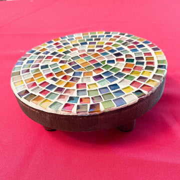 Small rainbow mosaic plant stand, handcrafted, featuring colorful tile design and sturdy metal frame for indoor or outdoor use.