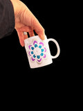 Handpainted coffee mugs by My Store featuring colorful floral designs on ceramic surfaces.