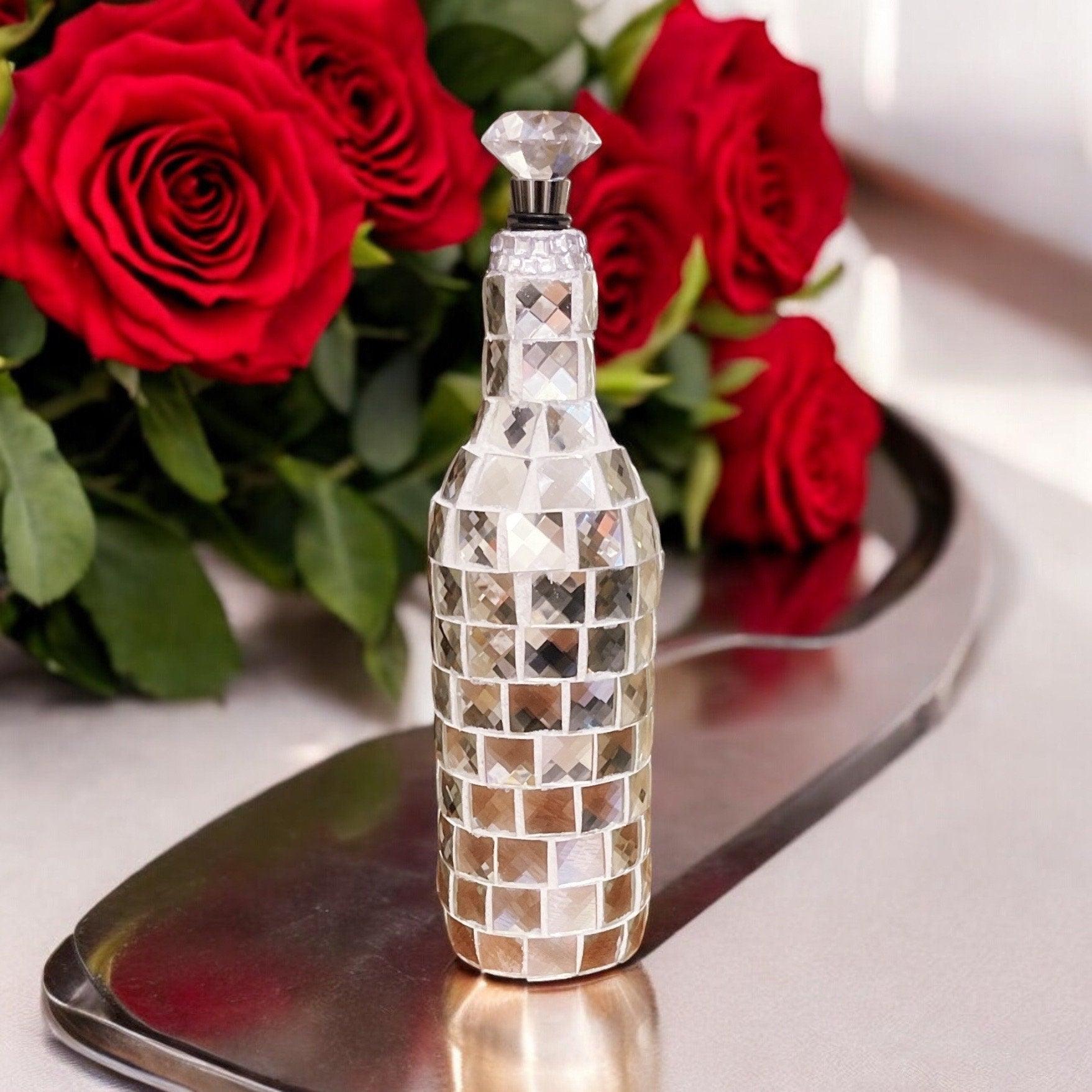 Silver mirrored mosaic wine decanter with geometric pattern, elegant and reflective, designed for serving wine in style.