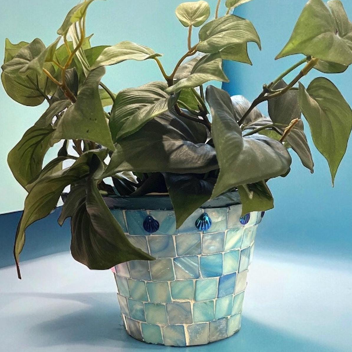 Artisan teal mosaic mother of pearl planter with intricate design, handcrafted by Miss Bette's Creations.
