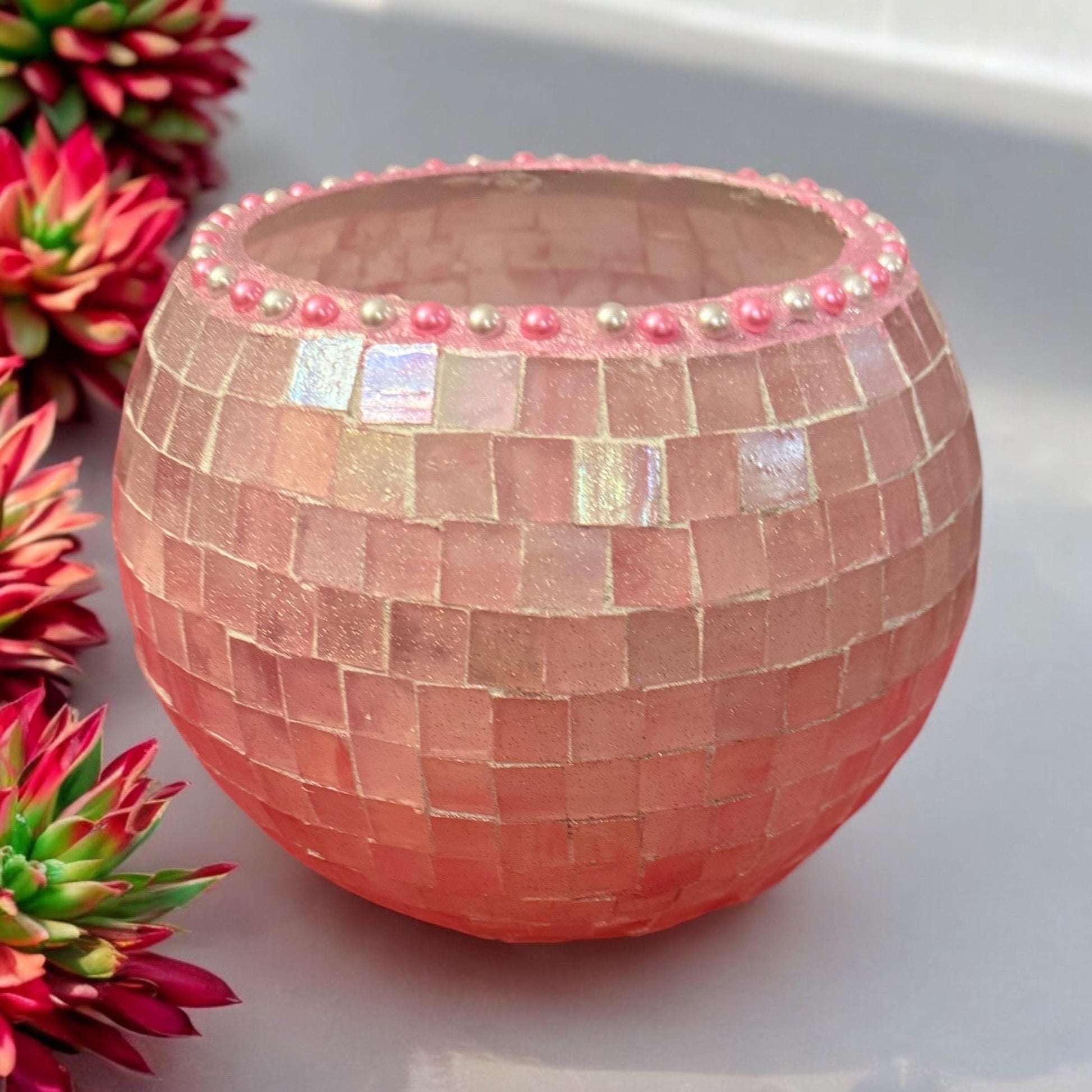 Blush rose mosaic globe vase with intricate pattern, glass craftsmanship, and decorative design for floral arrangements.