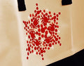 Large white and red custom canvas bag with sturdy handles, featuring a bold design suitable for everyday use.