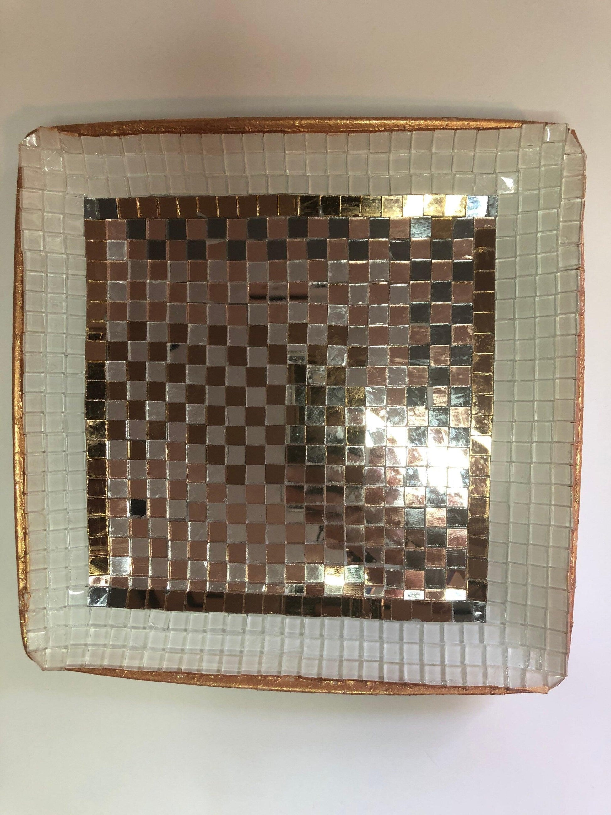 Handcrafted stained glass star suncatcher hanging with colorful glass panes and a metal chain for decorative sunlight display