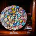 Handcrafted Tree of Life mosaic plant stand with colorful glass tiles and sturdy metal frame for indoor or outdoor use.
