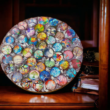 Handcrafted Tree of Life mosaic plant stand with colorful glass tiles and sturdy metal frame for indoor or outdoor use.