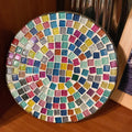 Handmade 7-inch rainbow mosaic plant stand with colorful ceramic tiles and metal frame for indoor or outdoor use.