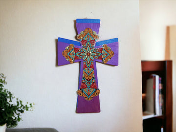 Decorated handmade Christian cross wall hanging with intricate details and craftsmanship, perfect for religious home decor.