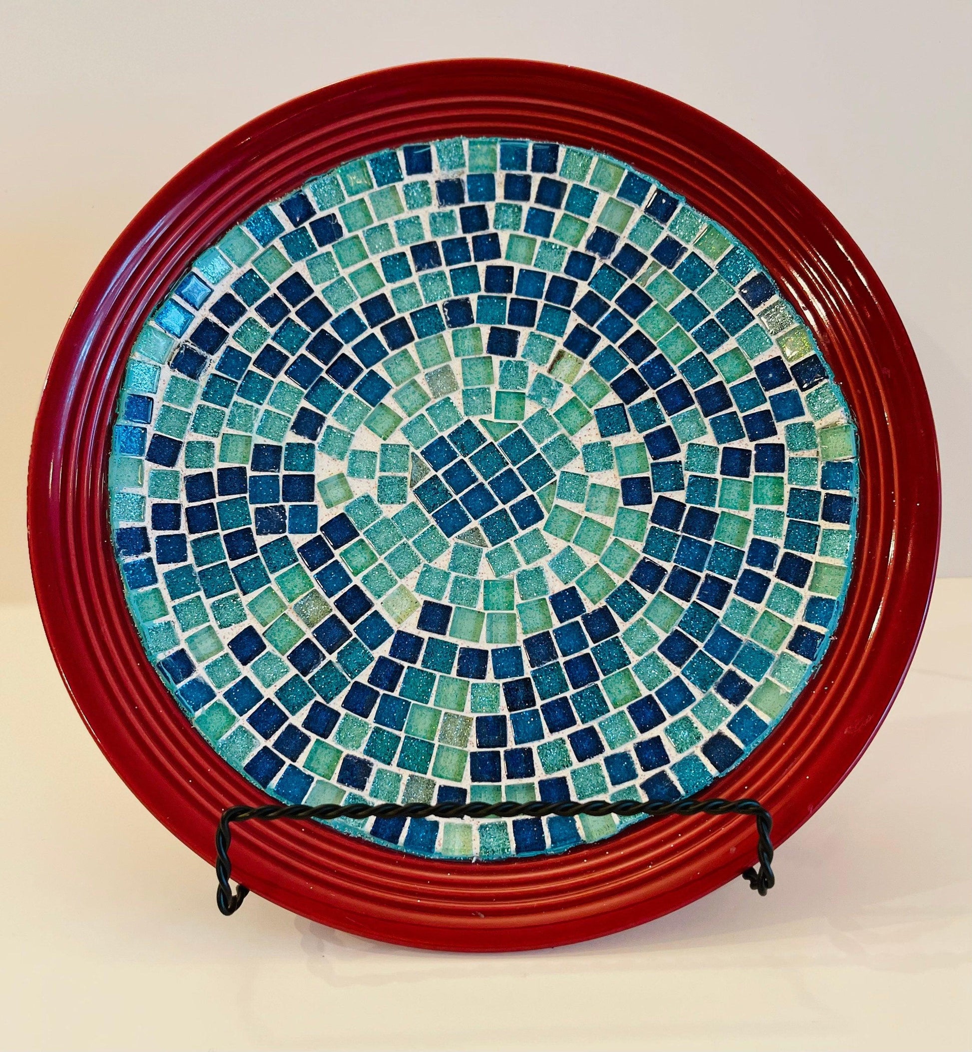 Deep crimson ceramic plate featuring a vibrant ocean breeze mosaic design, crafted by My Store.