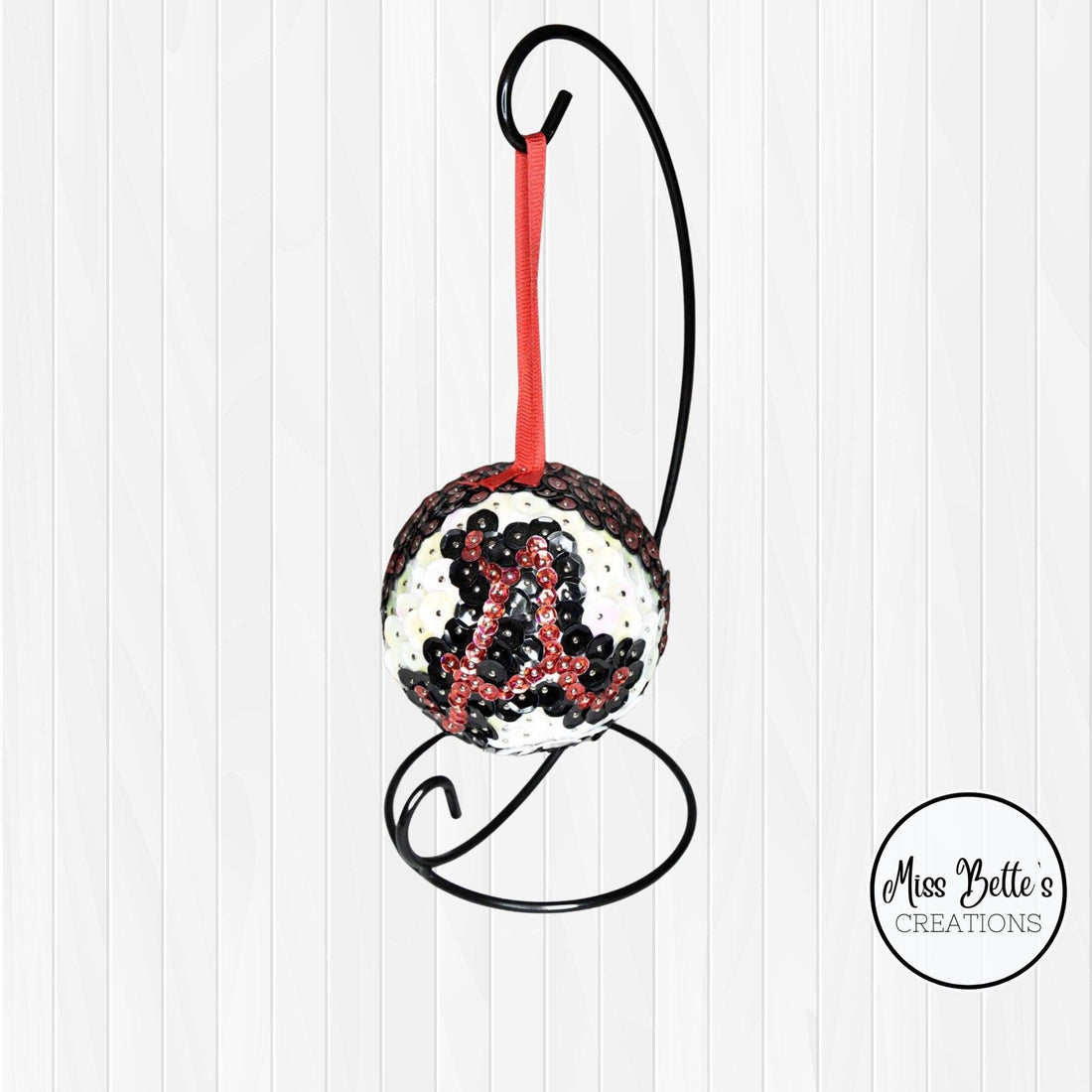 University of Alabama decorative ornament with team logo and crimson colors, perfect for college fan décor or gift.