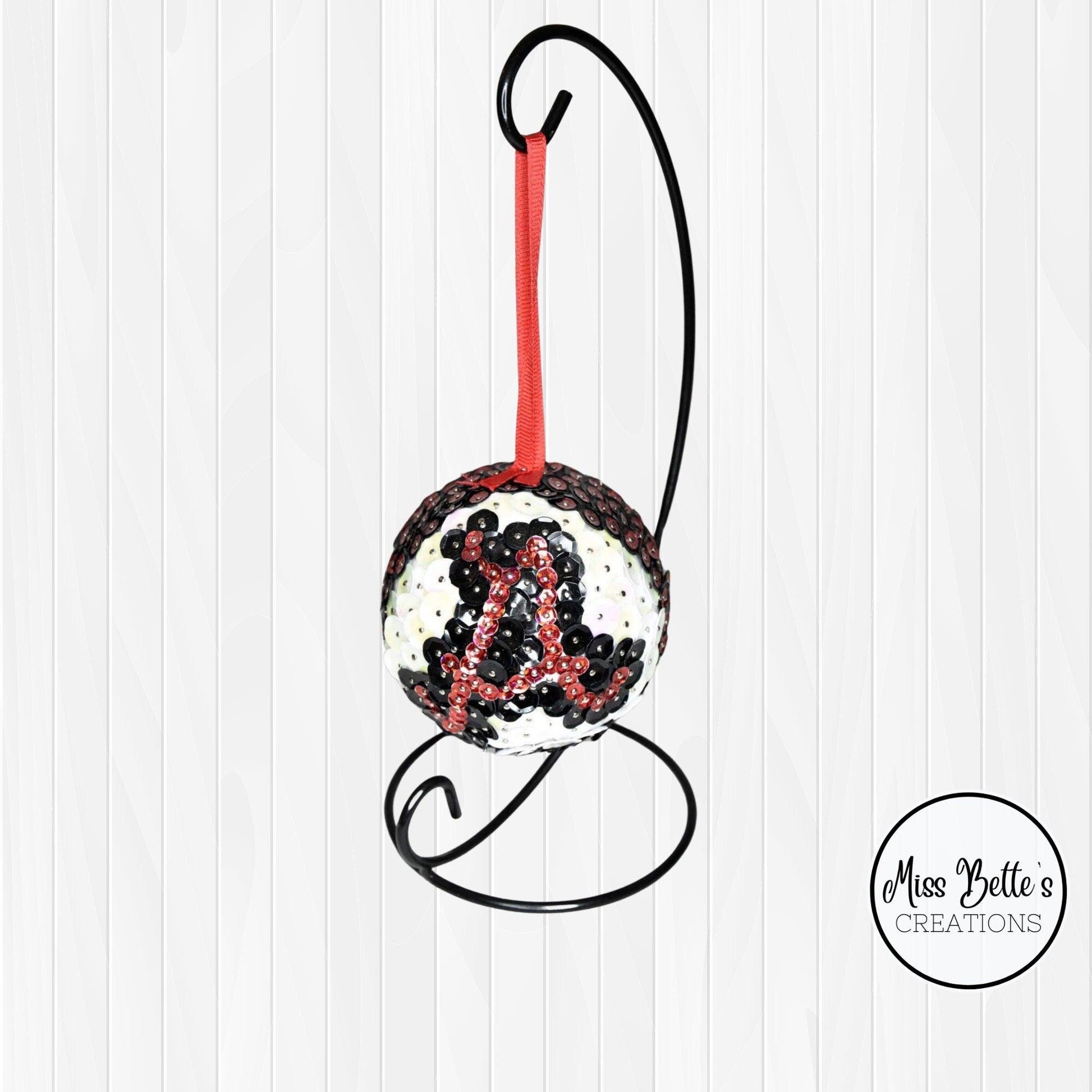 University of Alabama decorative ornament featuring the team's logo, perfect for college fans and sports memorabilia displays.