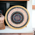 Handcrafted circular mosaic mandala wall art featuring vibrant colorful tiles and intricate geometric patterns for home decor.