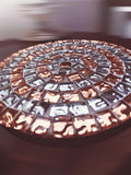 Handcrafted metallic mosaic plant stand set with intricate patterns, perfect for indoor or outdoor decorative plants.