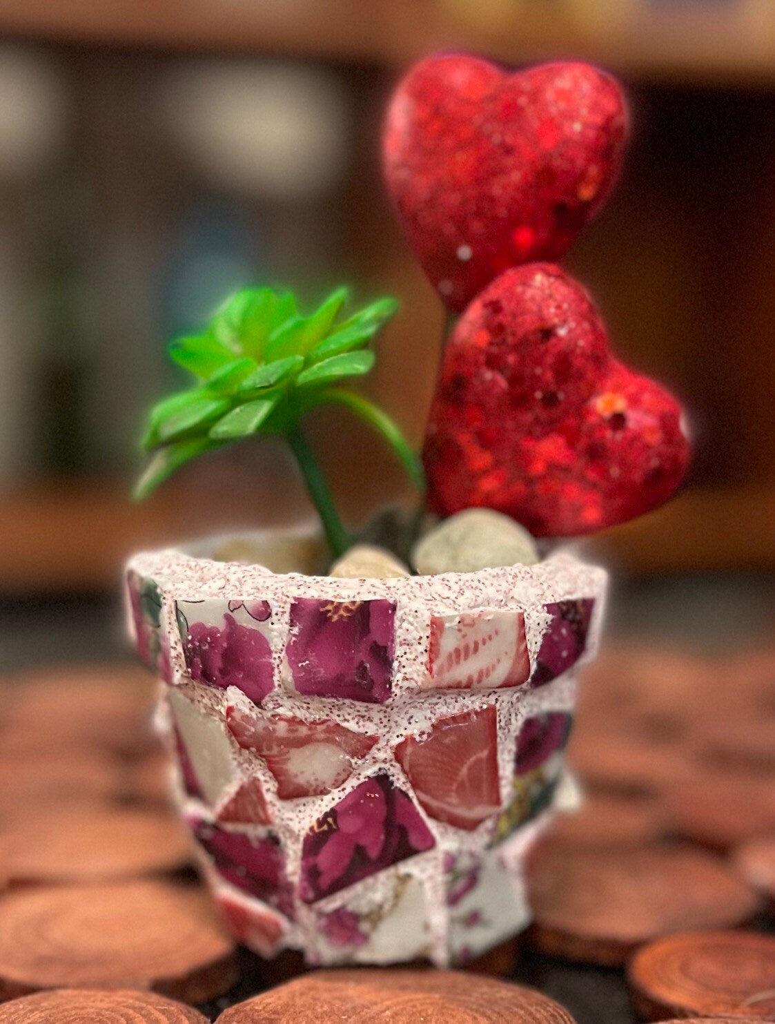 Handcrafted broken china heart mosaic planter with colorful mosaic tiles, designed for indoor or outdoor decorative use.