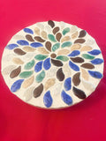 Handmade earth tone mosaic plant stand with colorful tiled design, perfect for supporting potted plants in home decor.