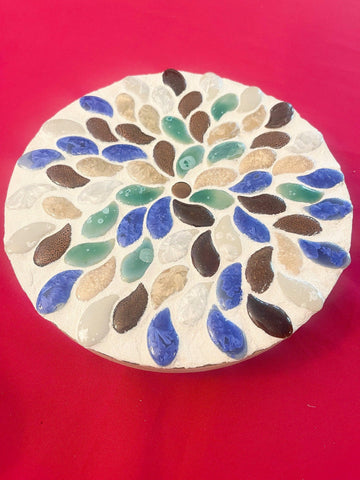 Handmade earth tone mosaic plant stand with colorful tiled design, perfect for supporting potted plants in home decor.