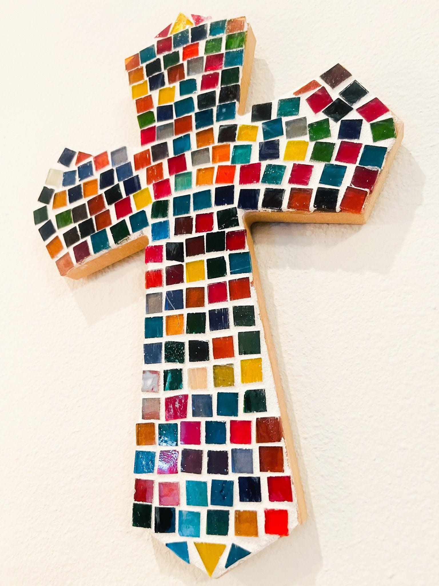Colorful handcrafted mosaic cross with multicolor tiles, featuring intricate design and detailed craftsmanship.