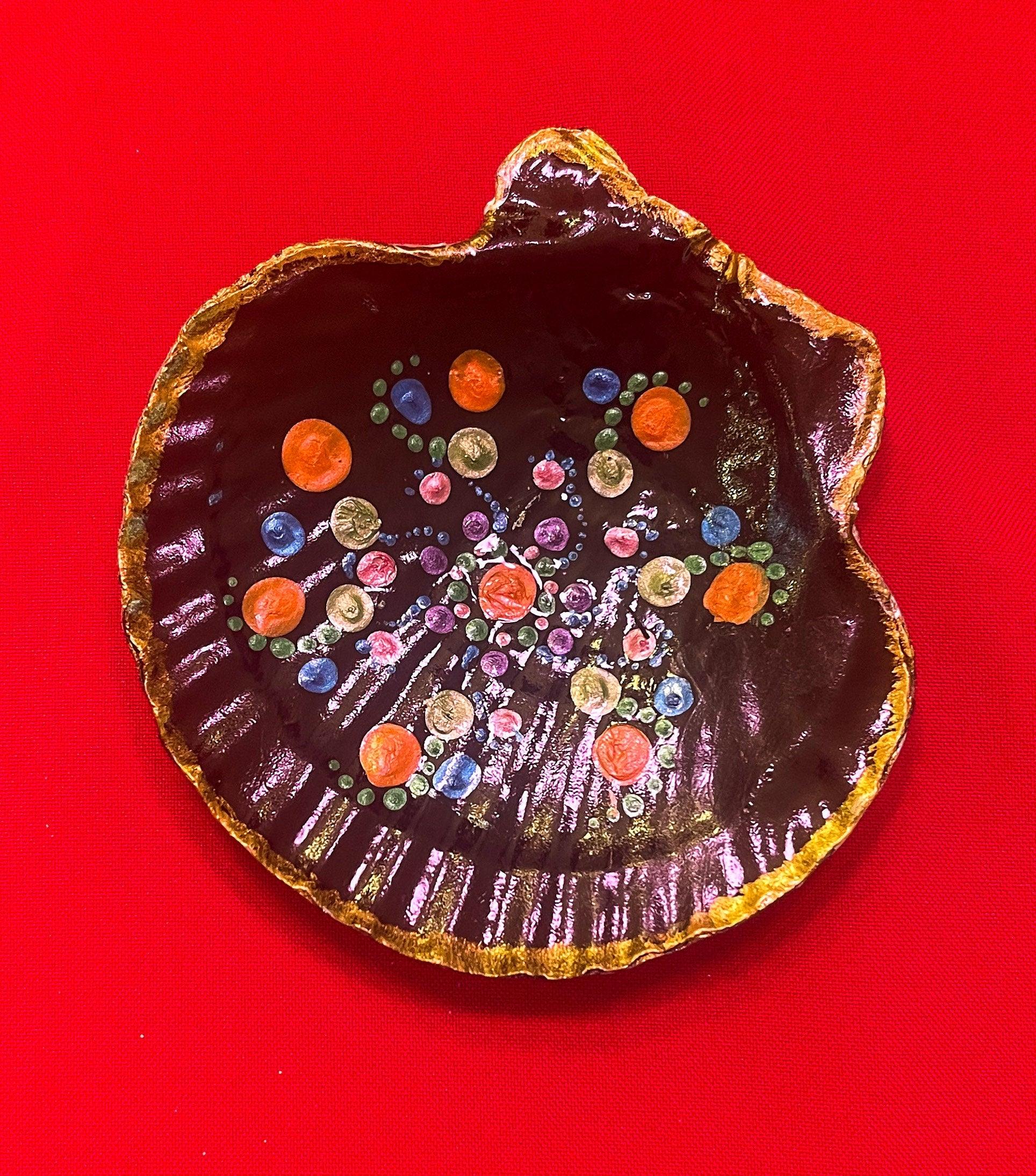 Hand painted ceramic ring dish featuring colorful floral designs, perfect for jewelry organization and decorative use.